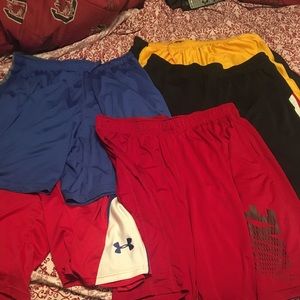 5 pair of Nike and under armor basketball shorts
